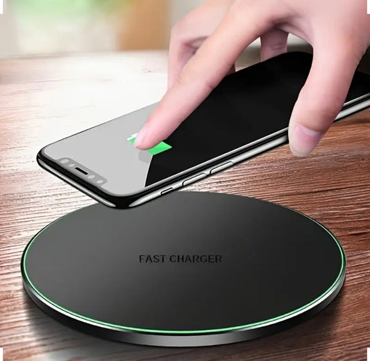Person using a wireless phone charger on a wireless charging pad