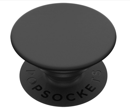 A black Pop Sockets phone grip stand with a matte finish, featuring the embossed brand name 'POPSOCKETS' on the circular base, shown against a plain white background.