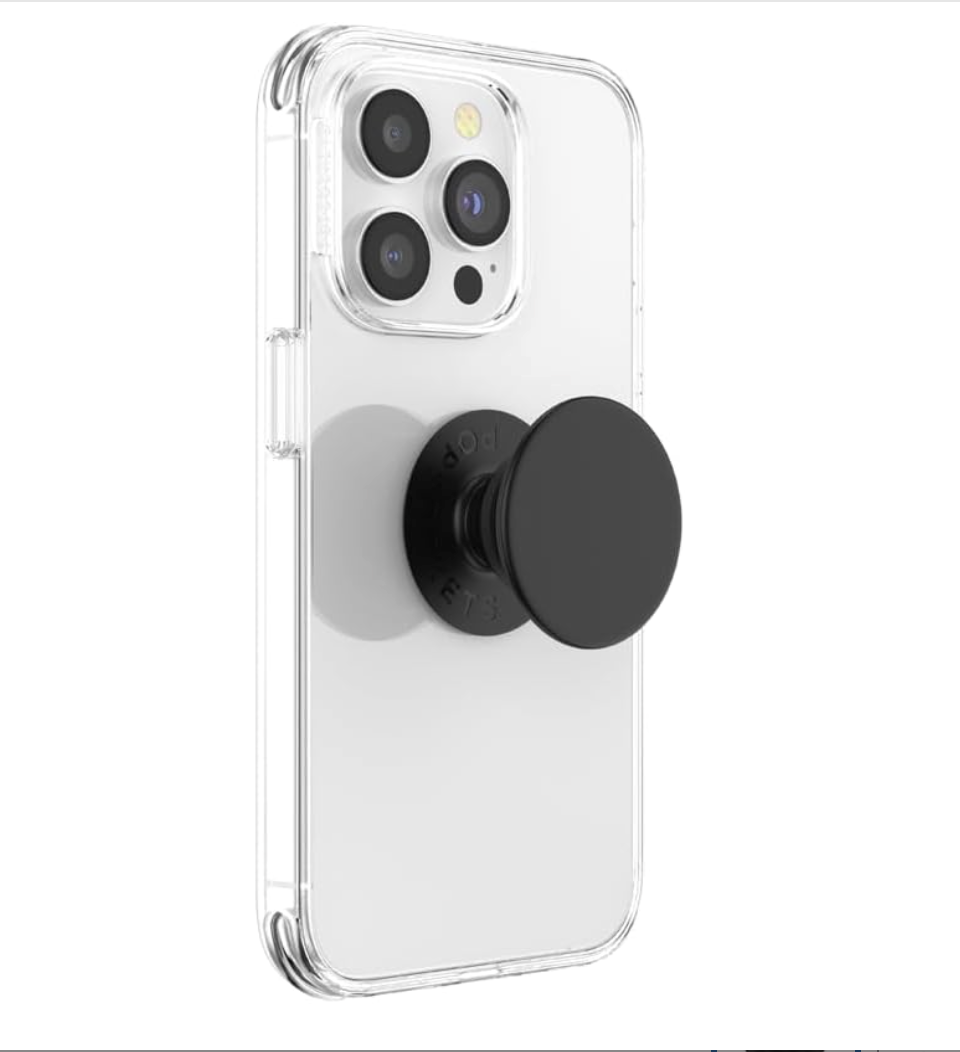 A clear protective phone case on an iPhone, featuring a black PopSocket grip on the back, shown against a plain white background.